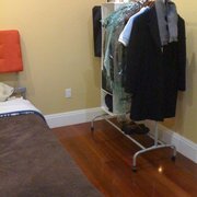 Rigga Clothes Rack with white closet storage and another bag with a zipper that one can place laundry in. (my room)